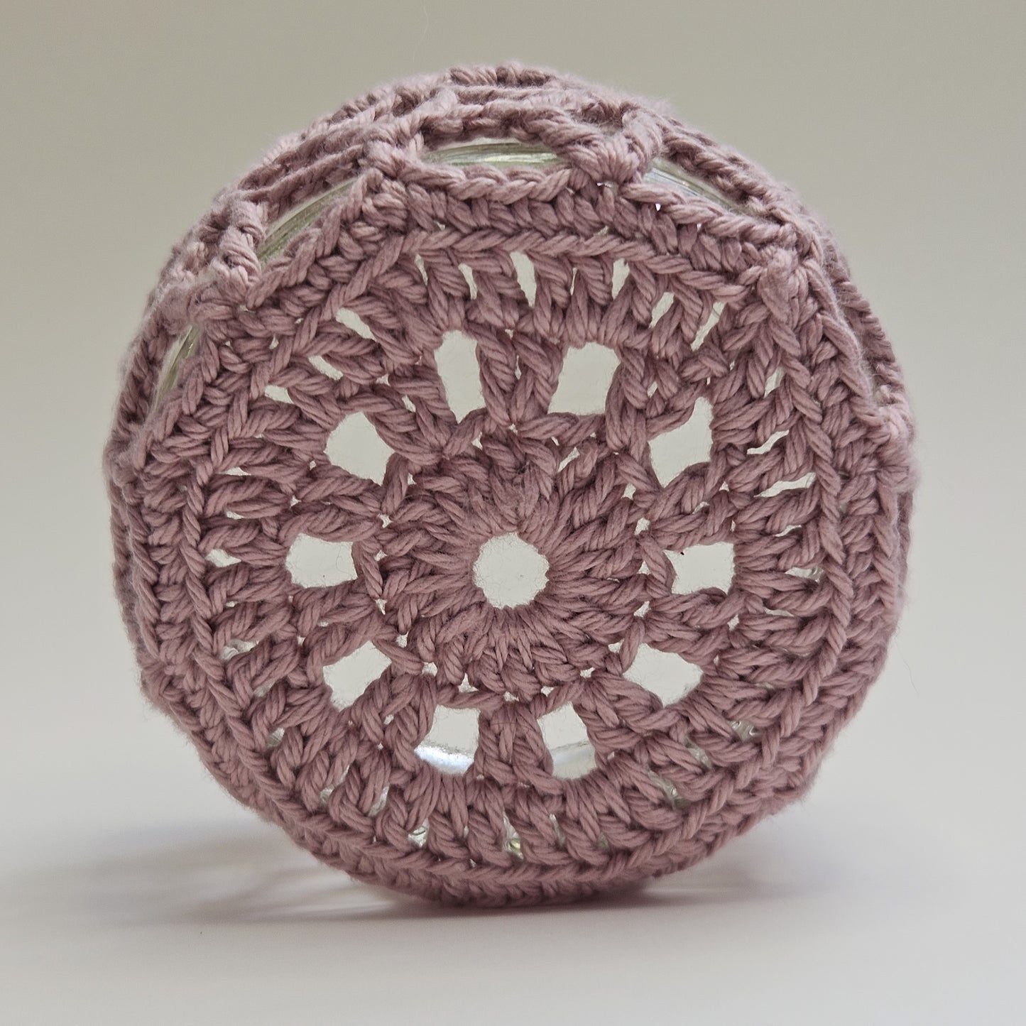 Crocheted glass ramekin cover showing underneath side